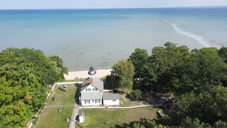 Mission-Point-Lighthouse-in-Grand-Traverse-Bay,-Michigan,-USA,-aerial-view