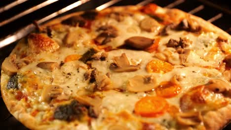 close-up-view-of-frozen-pizza-in-oven-getting-cooked