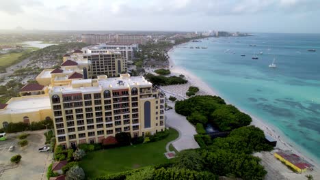 aerial-push-in-to-Palm-Beach,-Aruba-shoreline