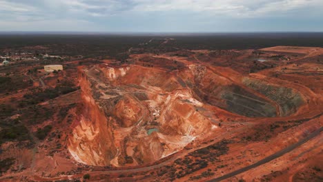 aerial-view-over-a-mine-pit-in-Kalgoorlie-Boulder,-australian-mining-city-in-Western-Australia