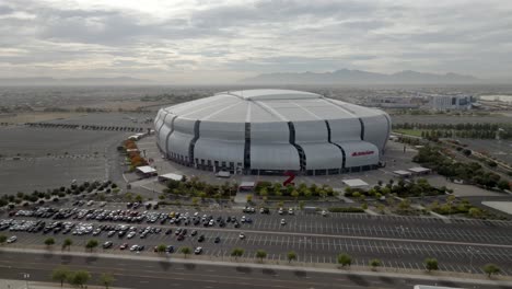 State-Farm-Stadium,-home-of-the-Arizona-Cardinals-National-Football-League-team-in-Glendale,-Arizona-with-drone-video-medium-shot-moving-in-a-circle