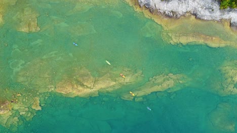 Aerial-View-Of-Sea-Kayaking-On-Georgian-Bay-Islands-In-Ontario,-Canada