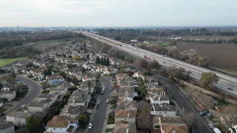 The-Highway-Runs-next-to-the-Suburban-Neighborhood-residential-area-us-highway-system