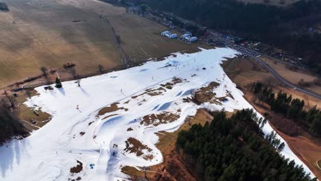 Aerial-view-over-snowy-mountain-skiing-track-slope,-event-at-Dolni-Morava