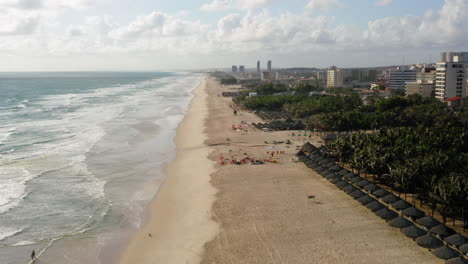 Aerial-view-of-the-sea,-a-big-green-area-and-the-city-around,-Praia-do-Futuro,-Ceara,-Brazil