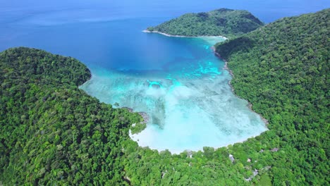 Magnificent-Views-of-Mai-Ngam-Beach-with-Turquoise-Waters-Surrounded-by-Green-Hillside-at-Surin-Island,-Thailand