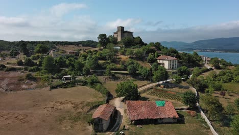 Nanclares-de-gamboa-village-with-castle-amidst-greenery,-basque-country,-spain,-aerial-view