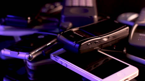 Bunch-of-Old-Used-Mobile-Phones-on-Spinning-Display