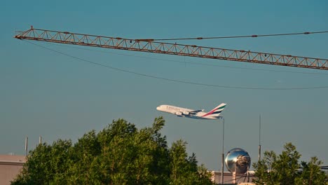 An-Emirates-airline-flight-begins-its-journey-after-taking-off-from-Dubai-International-Airport,-United-Arab-Emirates,-soaring-into-the-skies-on-its-route-to-its-destination