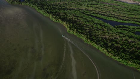 Fast-traveling-speedboat-over-the-gulf-of-Mexico-next-to-the-nature-of-the-island-Holbox