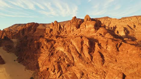 Rock-formation-around-Al-Ula,-Saudi-Arabia-in-golden-hour---Aerial-Landscape