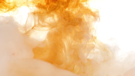 Abstract-Light-Tea-Coloured-Fluid-Slowly-Mixing-Together
