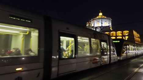 Metro-crossing-Ponte-Dom-Luis-I-upper-level-from-Gaia-to-Porto-with-Moisterio-da-Serra-do-Pilar-illuminated-in-background-at-night