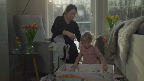 Mother-and-daughter-take-clothes-out