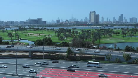 Dubai-skyline-from-Deira-with-a-view-of-Dubai-Golf-Course,-United-Arab-Emirates