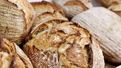 Fresh-loaves-of-sourdough-bread-displayed-for-sale