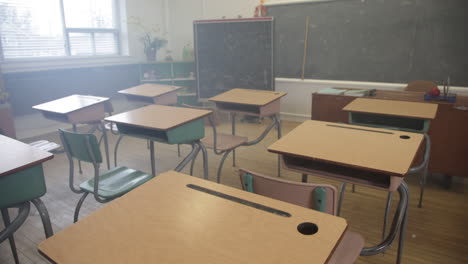 Empty-classroom-steady-shot-walking-through-desks