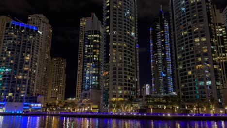 Pan-shot-of-Night-view-of-skyscrapers-in-Dubai-Marina---a-residential-neighborhood-and-a-district-in-Dubai