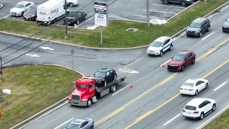 Police-Officer-cleaning-road-with-liquid-after-car-crash