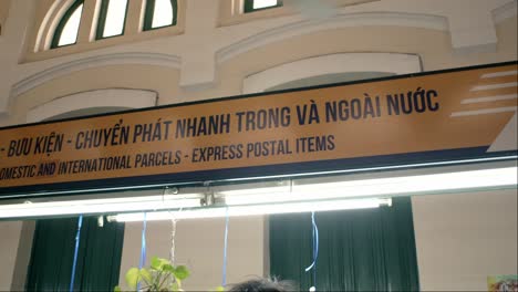 Interior-of-Saigon-post-office-with-signage-for-domestic-and-international-parcels,-express-postal-items