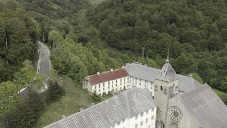 Drone-flying-over-Royal-Collegiate-of-Roncesvalles-Collegiale-royale-de-Roncevaux,-Navarre-in-Spain