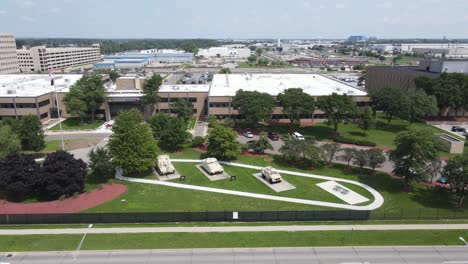 Aerial-sideways-close-up-shot-from-TACOM,-Tank-automotive-and-Armaments-Command,-Warren-Michigan,-USA-with-armored-vehicles-upfront