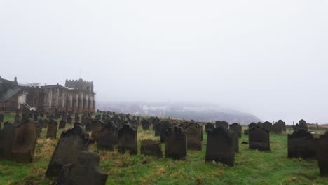 Views-of-the-graveyard-at-the-famous-St-Mary-the-Virgin-Church-in-the-harbor-town-of-Whitby-overlooking-the-famous-whitby-harbor