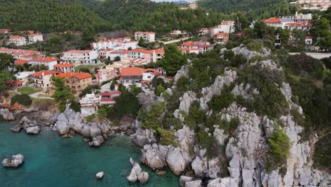 Aerial-view-of-the-Loutra-village-located-on-the-cliffs-and-by-the-sea-of-Chalkidiki