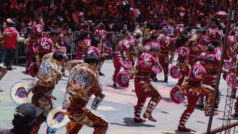 Glittering-ornate-costumes,-marchers-in-Oruro-Carnival-parade,-Bolivia