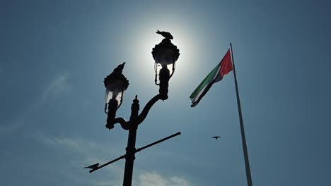 The-flag-of-the-UAE-waves-on-122-meters-high-giant-flagpole-in-Abu-Dhabi,-United-Arab-Emirates