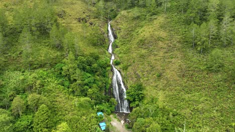 Efrata-waterfall-amidst-lush-greenery-at-lake-toba,-sumatra,-indonesia,-natural-beauty-captured-from-above,-aerial-view