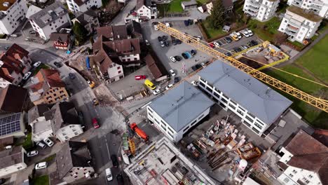 Driving-cars-on-road-in-Swiss-Town-during-sunny-day