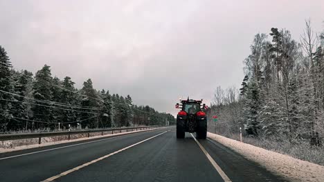 A-caravan-of-tractors-and-trucks-on-the-asphalt-road,-farmers-protest-against-government-decisions