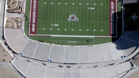 Aggie-Memorial-stadium-on-the-campus-of-New-Mexico-State-University-in-Las-Cruces,-New-Mexico-with-drone-video-moving-overhead