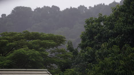 Rainfall-in-Krabi,-Thailand-during-the-tropical-rainy-season,-showcasing-the-lush-landscapes-of-Southeast-Asia