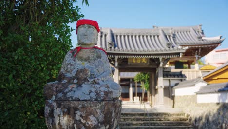 Jizo-Statue-outside-Temple-in-Osatsu-Town,-Toba-Japan-4k