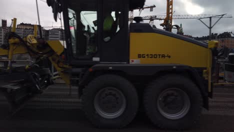 Tractor-passes-through-frame-at-construction-site-at-Slussen-in-Stockholm