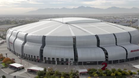 State-Farm-Stadium,-home-of-the-Arizona-Cardinals-National-Football-League-team-in-Glendale,-Arizona-with-drone-video-close-up-pulling-back