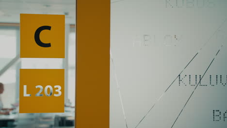 Glass-wall-inside-the-Estonian-ATC-building-with-support-staff-in-the-background