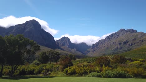 Pan-of-mountains-and-large-vineyard-on-sunny-day-in-South-Africa