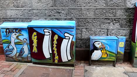 Street-art-paintings-of-seagulls-and-puffins-on-electricity-boxes