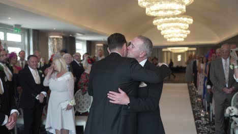 Father-of-the-bride-walks-her-down-the-aisle-to-husband-in-waiting