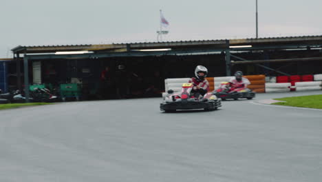 Kart-driver-steering-into-clipping-point-of-corner-to-maintain-speed-on-track