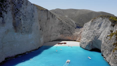 Aerial:-Navagio-bay-and-shipwreck-beach-in-Zakynthos,-Greece-In-Summer