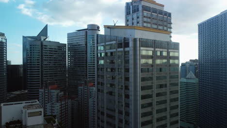 Aerial-view-away-from-office-buildings-and-condos-of-the-Makati-skyline,-in-Philippines