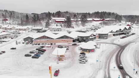 Sannidal,-Telemark-County,-Norway---Alti-Kragero-Shopping-Mall-Covered-in-Snow-on-a-Winter-Day---Aerial-Drone-Shot