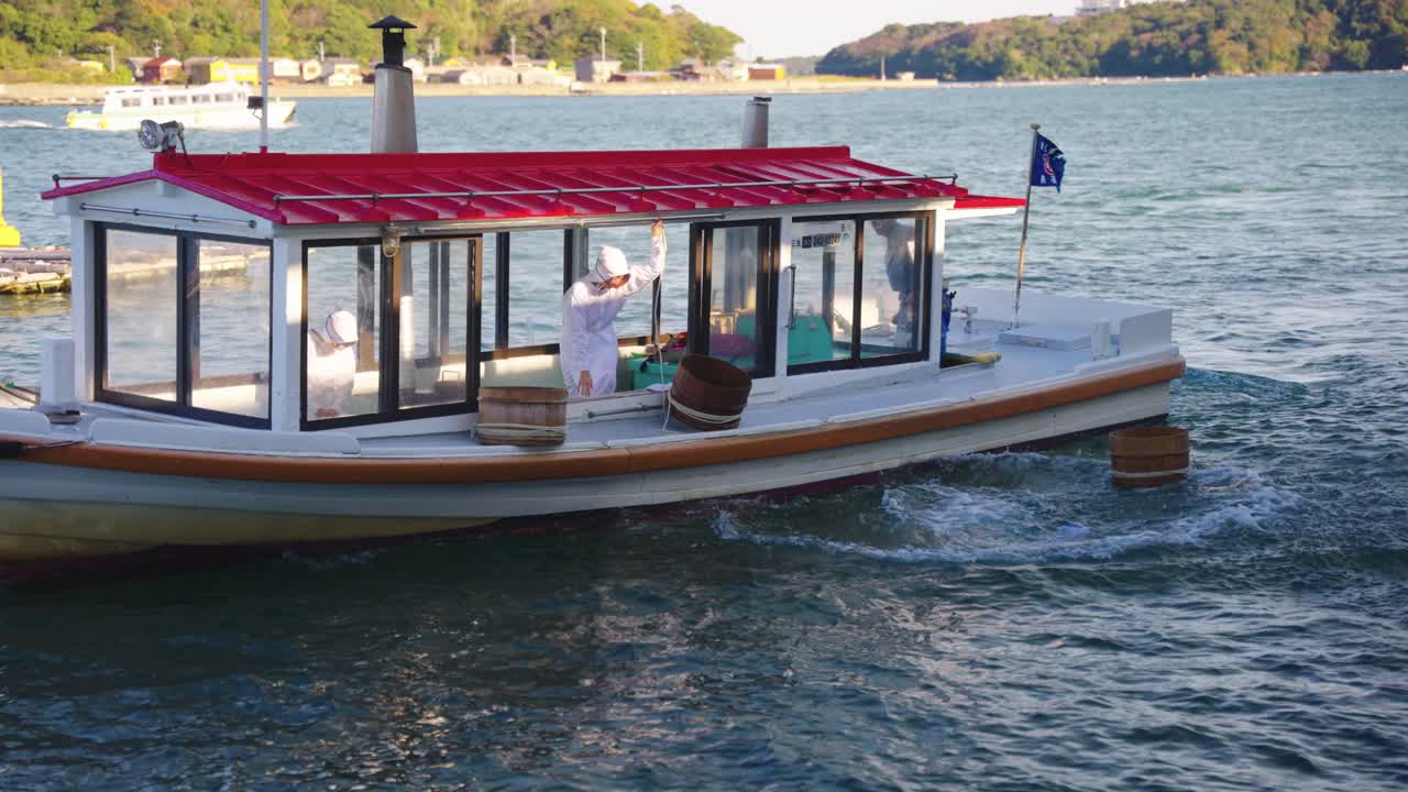Slow Motion Shot As Female Ama Divers Enter Water In Slow Motion For