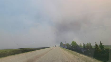 POV-From-Car-Driving-In-The-Road-With-A-View-Of-Wildfire-Smoke