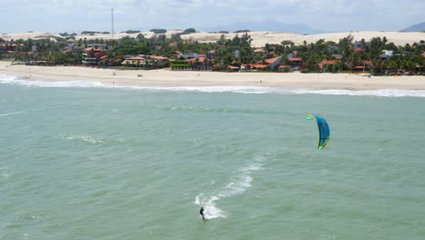 Aerial-view-of-people-practing-kite-surf,-Cumbuco,-Ceara,-Brazil