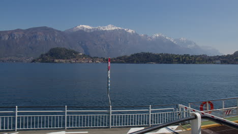 Lake-Como-And-Snowcapped-Mountains-Seen-From-Pier-At-Ferry-Terminal-In-Bellagio,-Italy